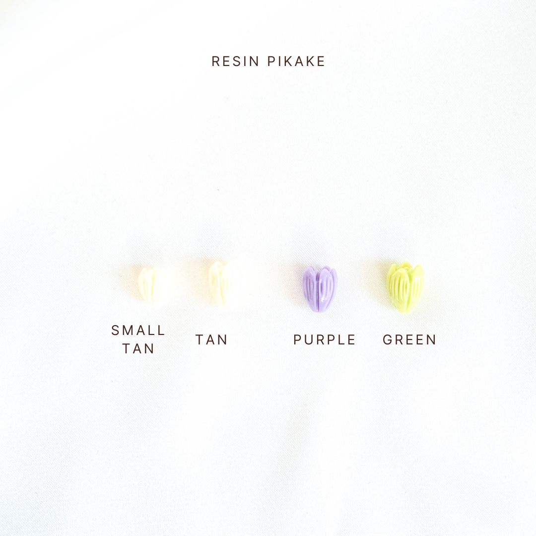 Color swatches labeled 'Small Tan', 'Tan', 'Purple', and 'Green' with 'Resin Pikake' text above.
