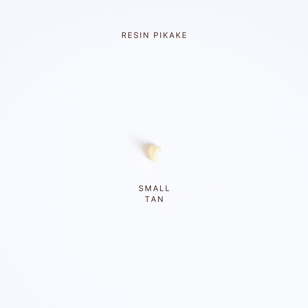 Small tan resin Pikake on a white background with 'Resin Pikake' text above.