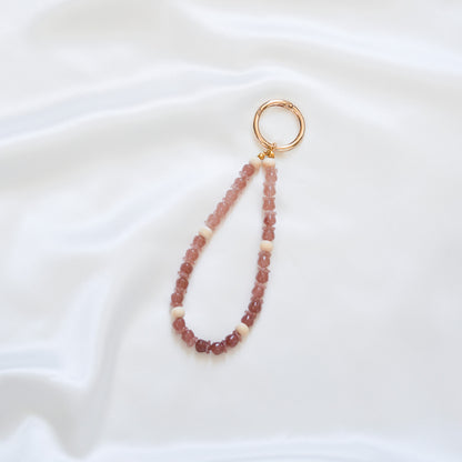 Beaded rose beaded keychain with gold clasp on a white background