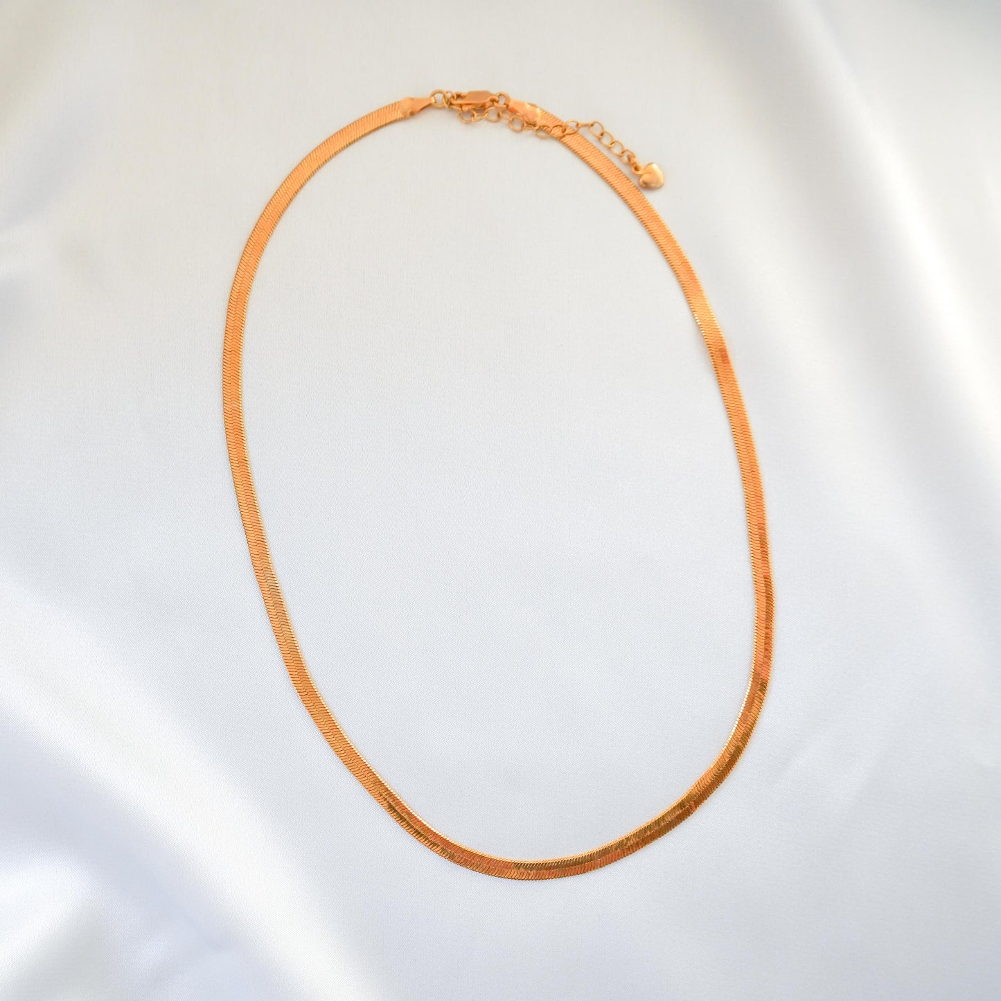 Gold necklace on a white background