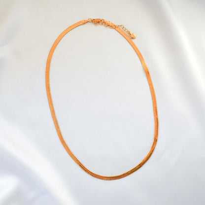 Gold necklace on a white background