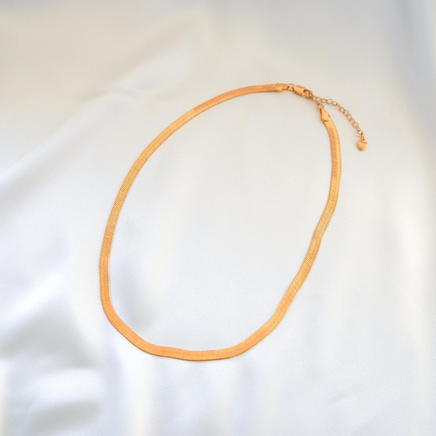 Gold necklace on a white background