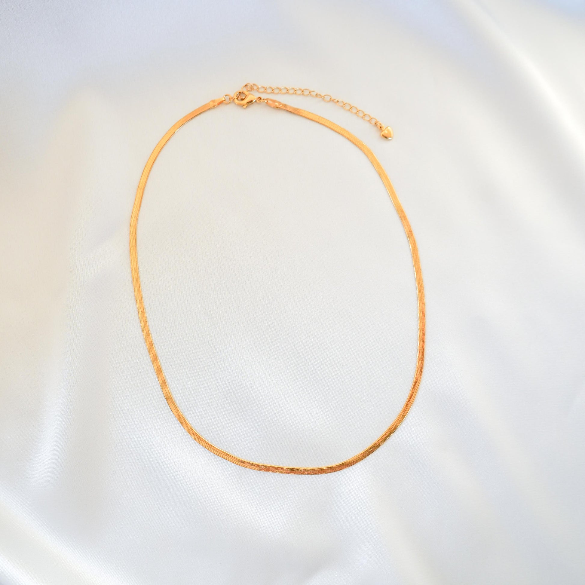 Gold necklace on a white background