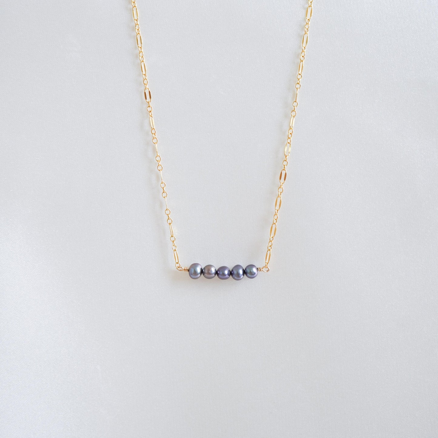 Gold necklace with five blue freshwater pearls