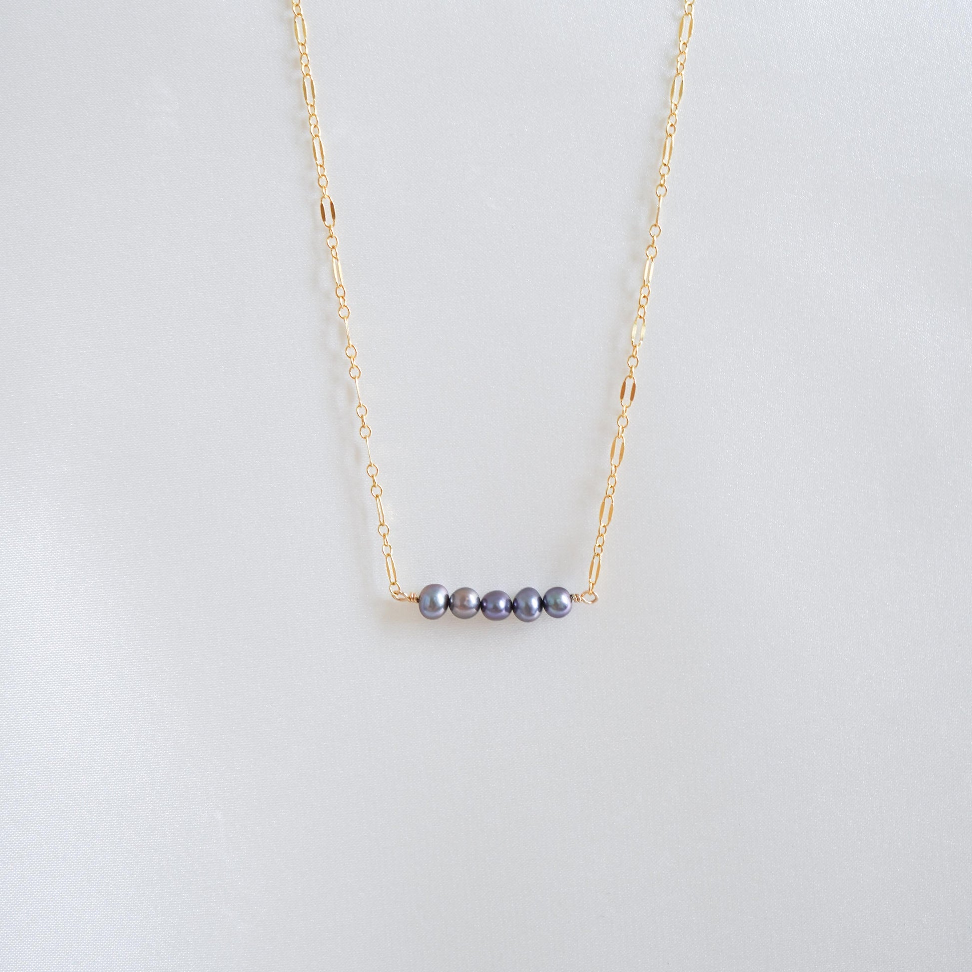 Gold necklace with five blue freshwater pearls
