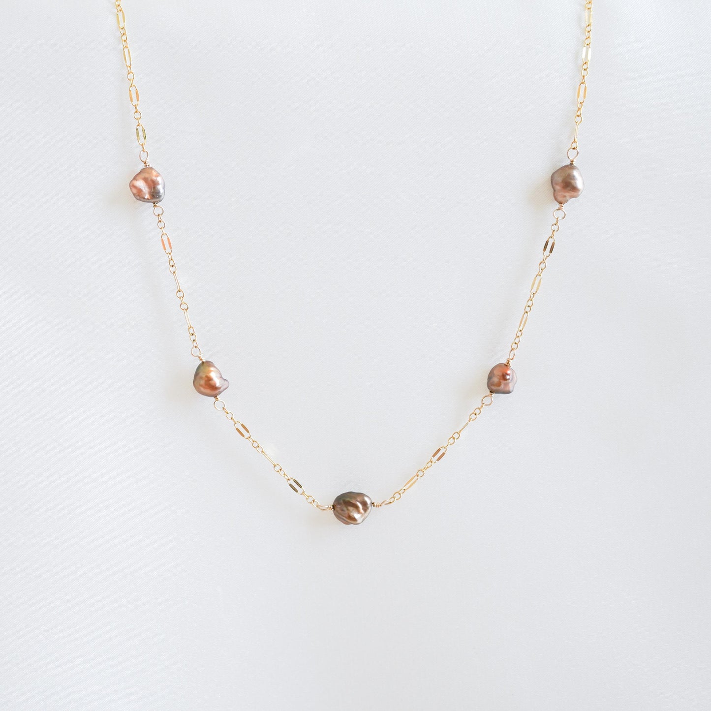 Necklace with brown keshi pearls on gold chain