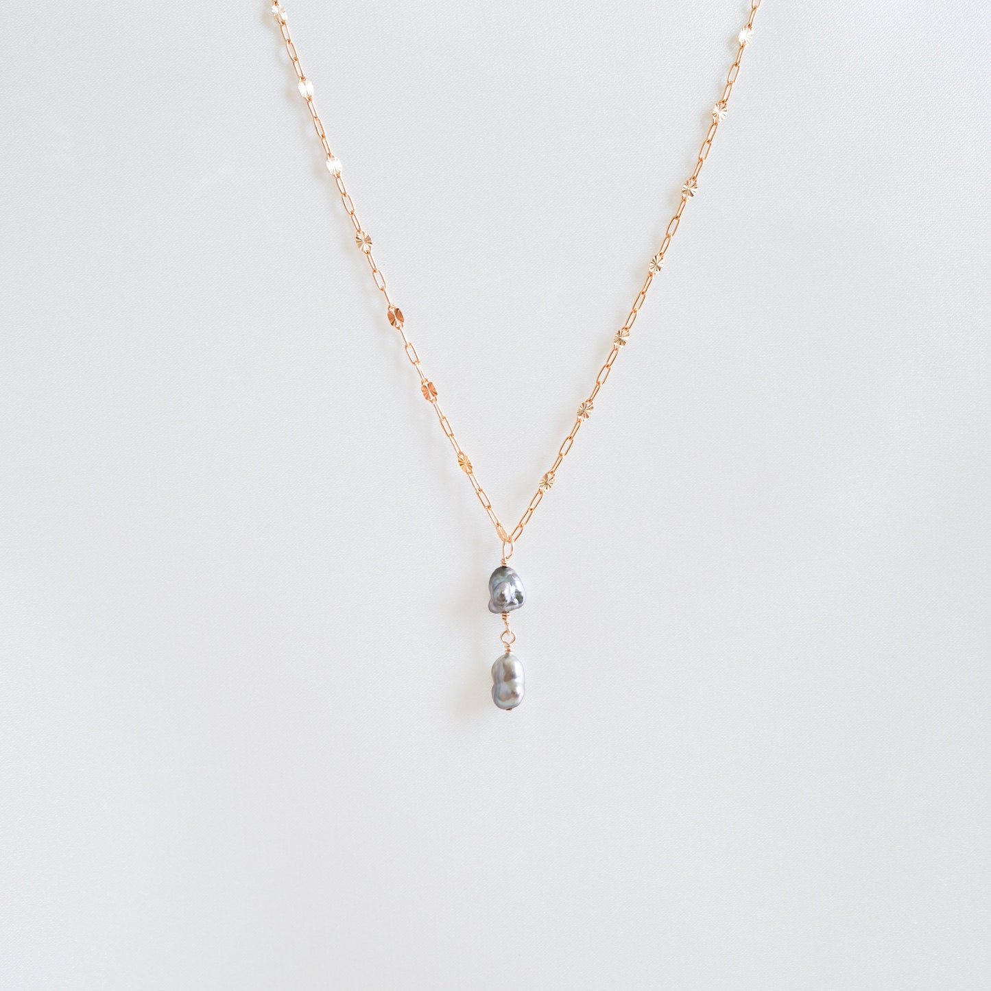 Necklace with two hanging keshi pearls on gold chain