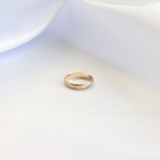 Gold ring on a white background