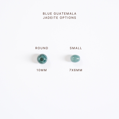 Two blue jadeite beads with size labels on a white background